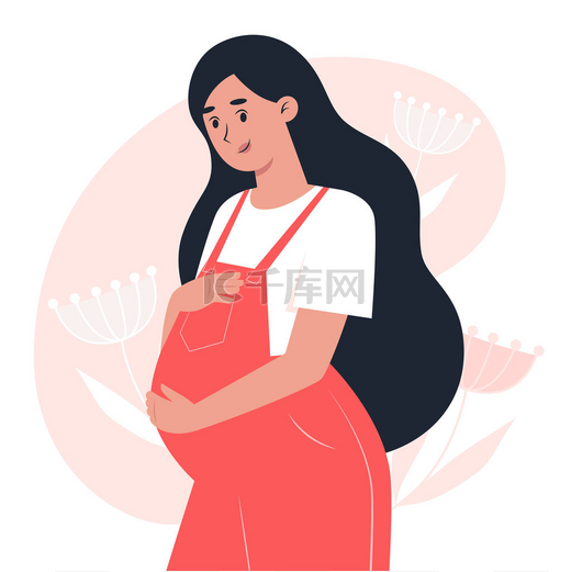穿着工作服的年轻孕妇用手抱着肚子、怀孕和做母亲图片