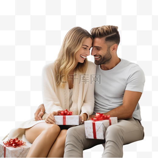 圣诞夜，一对相爱的跨国情侣坐在沙发上在客厅交换礼物图片