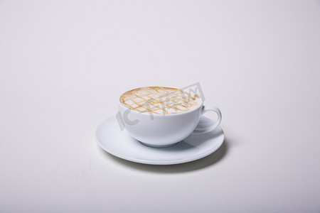 热饮拉花咖啡饮品摄影图