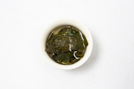绿茶茶叶摄影照片_野生铁观音绿茶茶叶摄影图配图