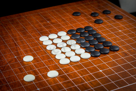 下围棋的小孩摄影照片_中国国粹围棋摄影图