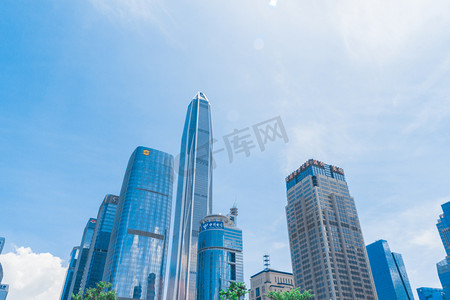 蓝天白云下的高楼大厦摄影图