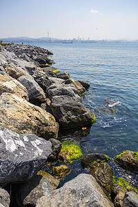 海昌渔人码头摄影照片_海边码头岩石摄影图
