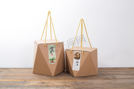 端午粽子包装盒摄影照片_棕子包装盒礼盒礼物袋手提袋摄影图