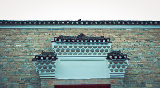 中国风国潮建筑摄影照片_复古建筑大门门顶摄影图