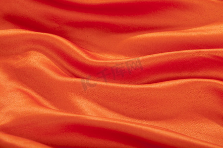 丝绸礼结摄影照片_丝绸质感纹理橙