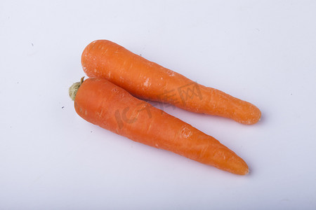 扁平几何橙色摄影照片_营养胡萝卜蔬菜摄影图配图 