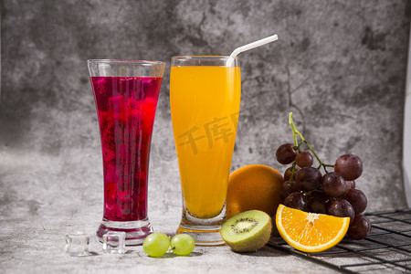 创意橙汁艺术图案摄影照片_橙汁火龙果汁摄影图