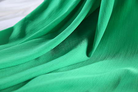 绿色背景质感摄影照片_绿色雪纺布料
