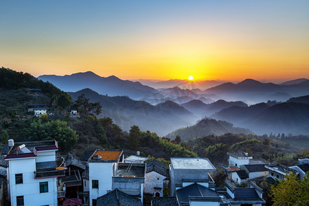 秋天夕阳落日中国风山峦摄影图