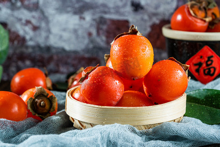 新鲜水果火罐柿子摄影图