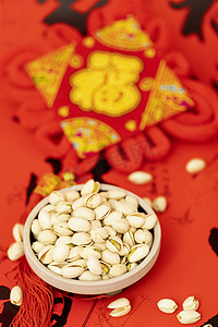 大年初二春节海报摄影照片_新年开心果坚果过年喜庆春节摄影图