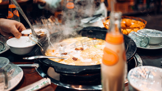 火锅节约粮食摄影照片_火锅美食摄影图