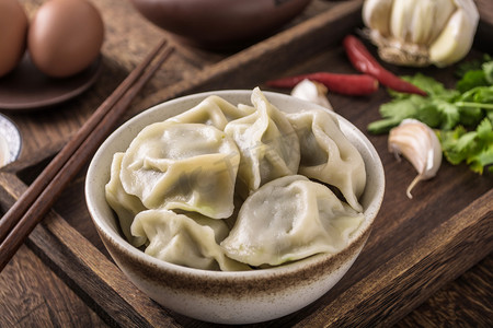 节日美食包饺子摄影图配图冬至美食水饺醋摄影图圣诞节摄影图餐饮美食