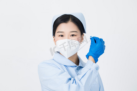 戴口罩倡议书摄影照片_护士提醒你戴好口罩 摘掉口罩