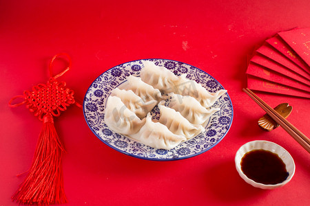 新年包饺子摄影照片_包饺子喜庆美食新春过年节日摄影图配图