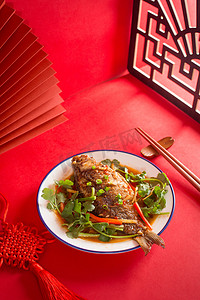 中餐过年餐饮美食家常菜红色红烧鱼年年有鱼摄影图配图