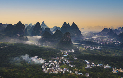 夕阳摄影照片_城市夕阳桂林山水山脉无人机拍摄摄影图配图