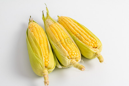 农副产品室内三个半开玉米棚拍静物摄影图配图