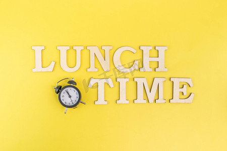 提示摄影照片_午餐背景中午钟表餐厅用餐时间提示摄影图配图