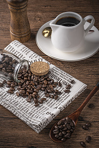 咖啡咖啡豆咖啡桌子散落摄影图配图
