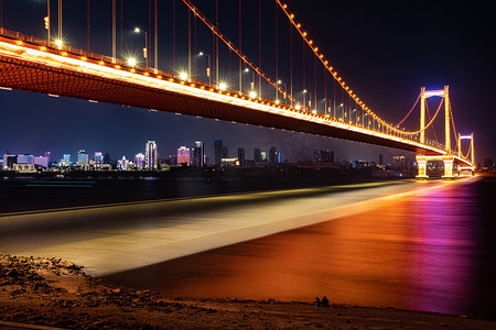 武汉城市建筑夜晚建筑鹦鹉洲大桥长曝光摄影图配图