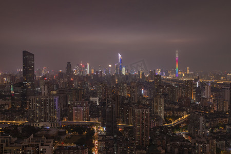 金融科技宣传摄影照片_广州城市建筑夜景晚上城市群楼顶俯视摄影图配图