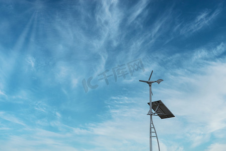 风力风车摄影照片_新能源白天风车太阳能户外发电摄影图配图