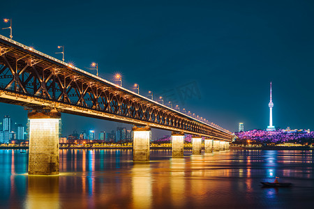 电视台摄影照片_武汉城市建筑夜晚城市地标长江大桥仰拍摄影图配图