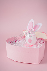 粉色可爱小清新摄影照片_复活节兔子节日粉色背景摄影图配图