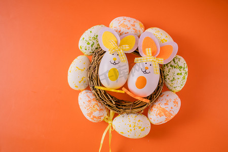 小清新橘色背景摄影照片_复活节节日兔子复活蛋摆拍摄影图配图
