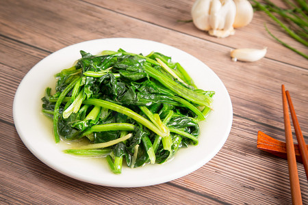 餐饮开业代金券摄影照片_中餐炒菜青菜菠菜清淡摄影图配图