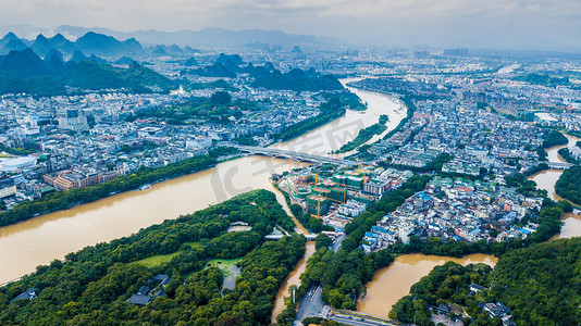 平静的江水摄影照片_航拍实拍城市江水洪峰过境夏季暴雨后城市建筑群