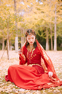 中国风国潮红摄影照片_女性神态人像女生红裙虚化肖像摄影图配图