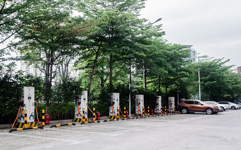 节能减排ppt摄影照片_环保电动汽车新能源充电桩摄影图配图