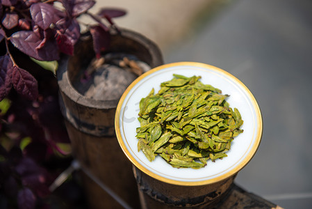 一颗柠檬绿茶摄影照片_西湖龙井绿茶下午绿茶室外摄影摄影图配图