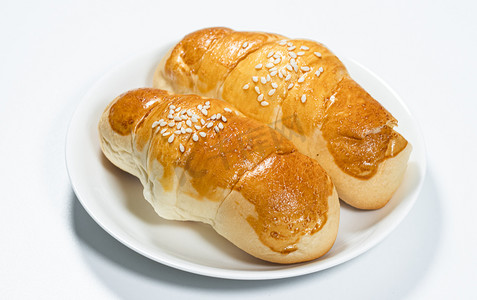 面包早餐白天羊角包面包餐厅吃早餐摄影图配图