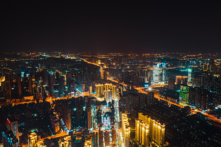 民族大道摄影照片_武汉城市建筑群夜晚建筑群光谷民族大道航拍摄影图配图