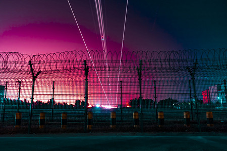 赛博朋克音乐元素摄影照片_赛博朋克夜晚机场白云机场光绘摄影图配图