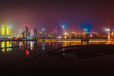 沙滩夏日旅游摄影照片_南昌城市夜景夜晚城市夜景南昌江滩航拍摄影图配图