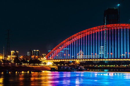 汉水安康摄影照片_武汉城市地标夜晚地标晴川桥慢门摄影图配图
