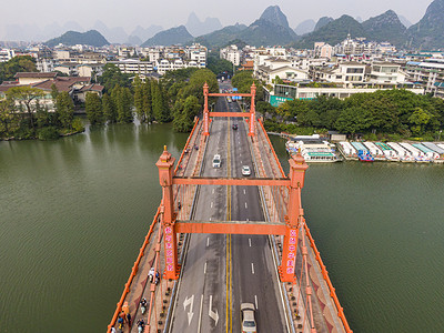 蓝天航拍摄影照片_广西中午桂林铁索大桥航拍摄影图配图