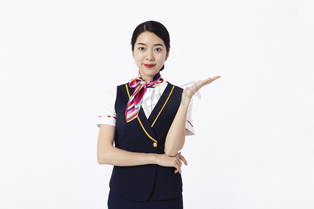 空姐飞机提示摄影图配图登机白天女乘务员和男乘客机舱内部欢迎手势