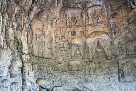 洛阳摄影照片_洛阳白天龙门石窟雕塑室外旅游摄影图配图