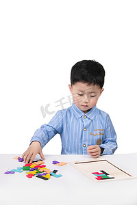 六一儿童节北京摄影照片_儿童节六一小男孩教室拼图摄影图配图