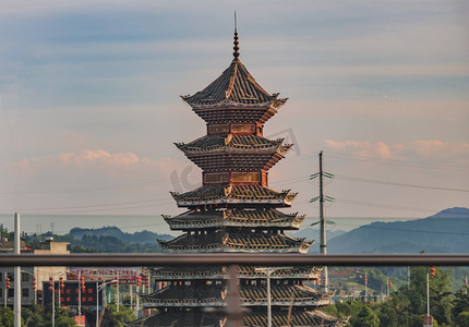 广西特色摄影照片_广西侗族建筑下午塔庙车上拍摄摄影图配图