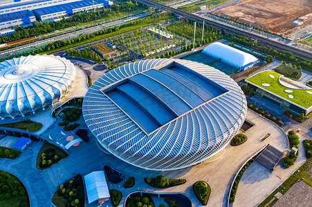 晴天摄影照片_武汉城市建筑晴天建筑国际网球中心俯拍摄影图配图