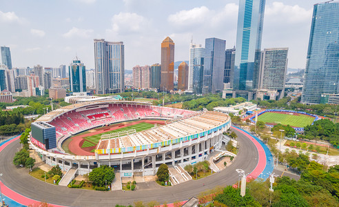 广州蓝天天河体育场高楼大厦航拍摄影图配图