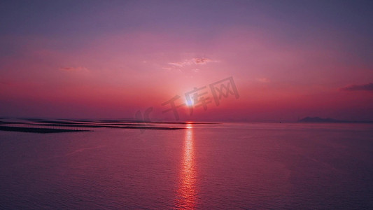 唯美航拍海边粉色夕阳风景