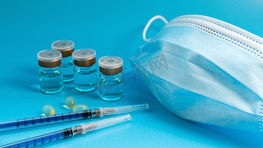 防疫宣传蓝摄影照片_疫苗白天新冠疫苗室内防疫摄影图配图